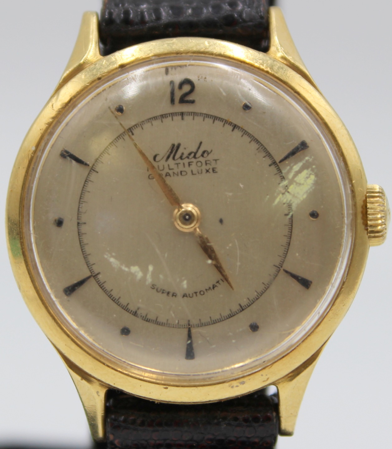 JEWELRY. MEN'S MIDO 18KT GOLD AUTOMATIC