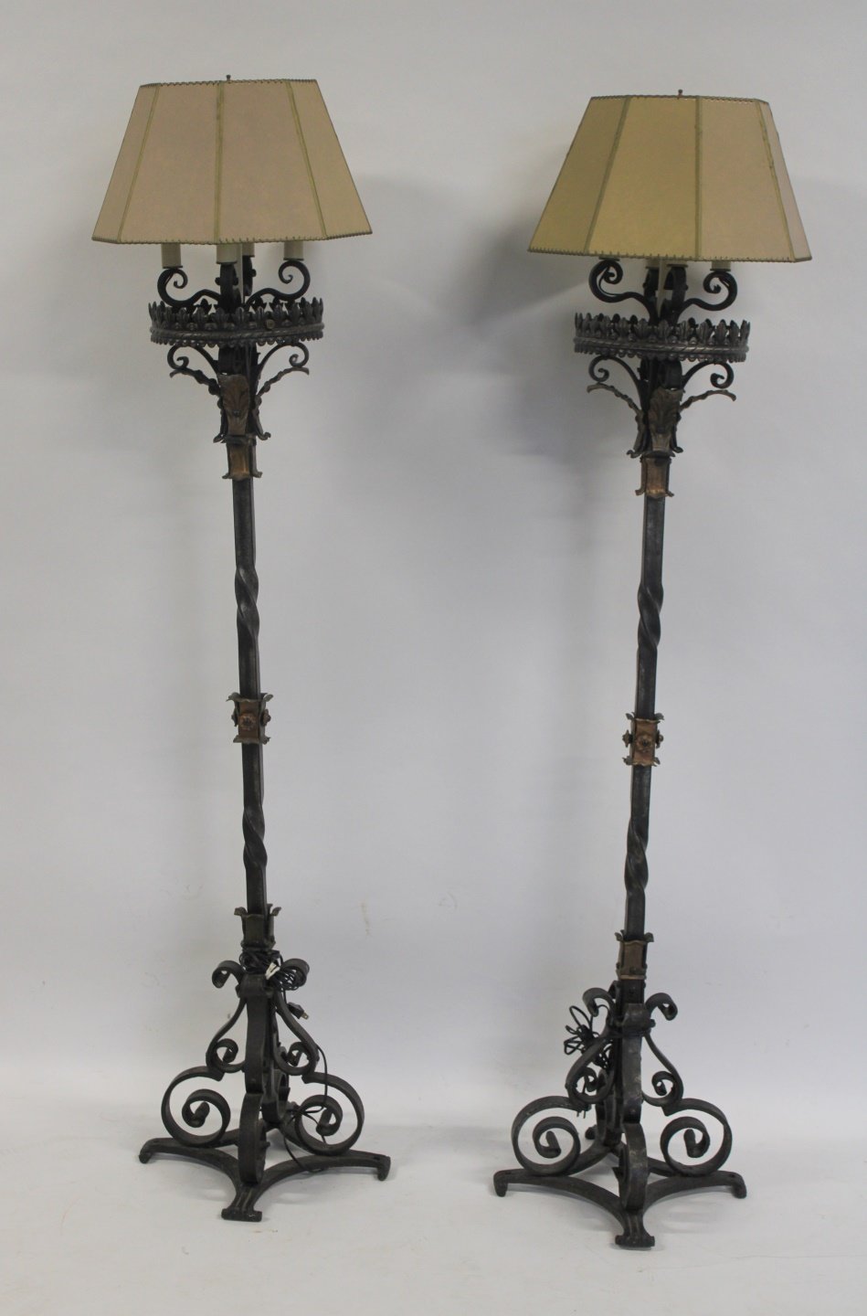 AN ANTIQUE PAIR OF WROUGHT IRON TORCHIERES