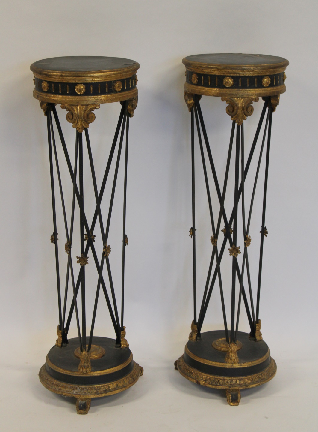 AN ANTIQUE PAIR OF EBONIZED, GILT