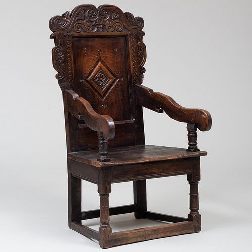 CHARLES II STYLE CARVED OAK ARMCHAIRCarved