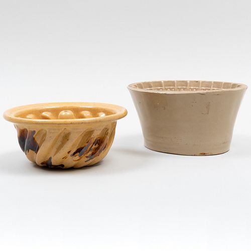 TWO GLAZED EARTHENWARE MOLDS, POSSIBLY