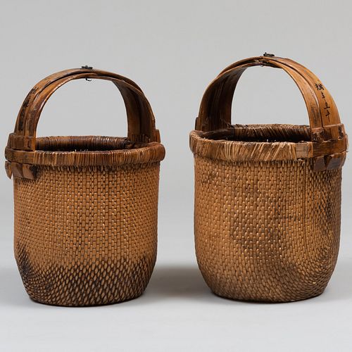 TWO ASIAN WOVEN BASKETS WITH WOODEN