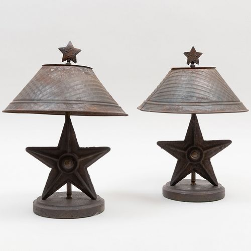 PAIR OF CAST METAL STAR FORM LAMPS