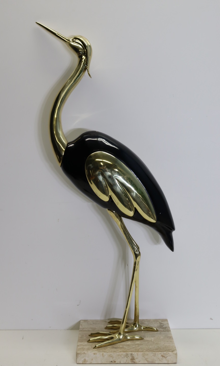 A VINTAGE BRASS AND ENAMELED HERON.