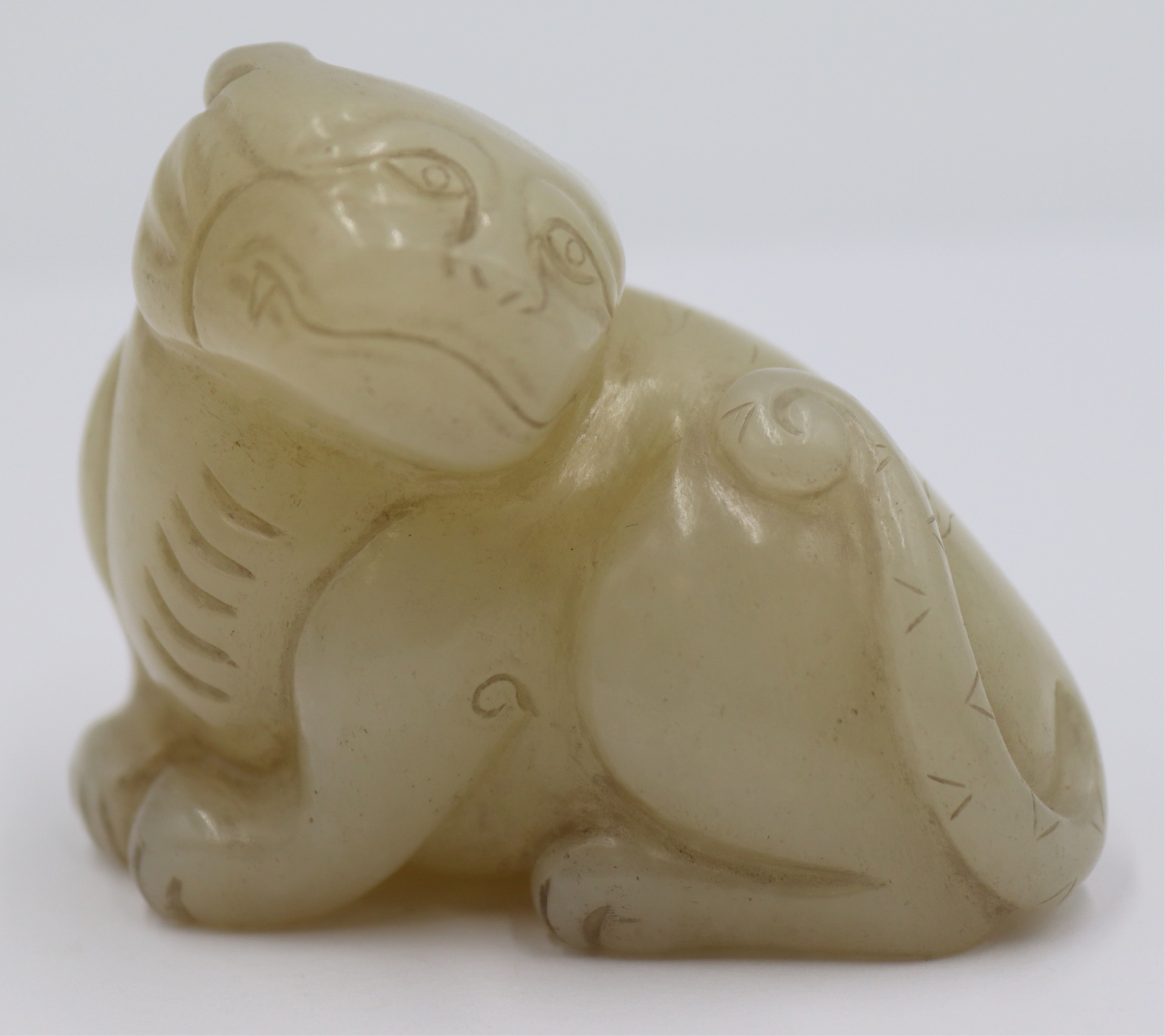 CHINESE CARVED WHITE JADE CAT.