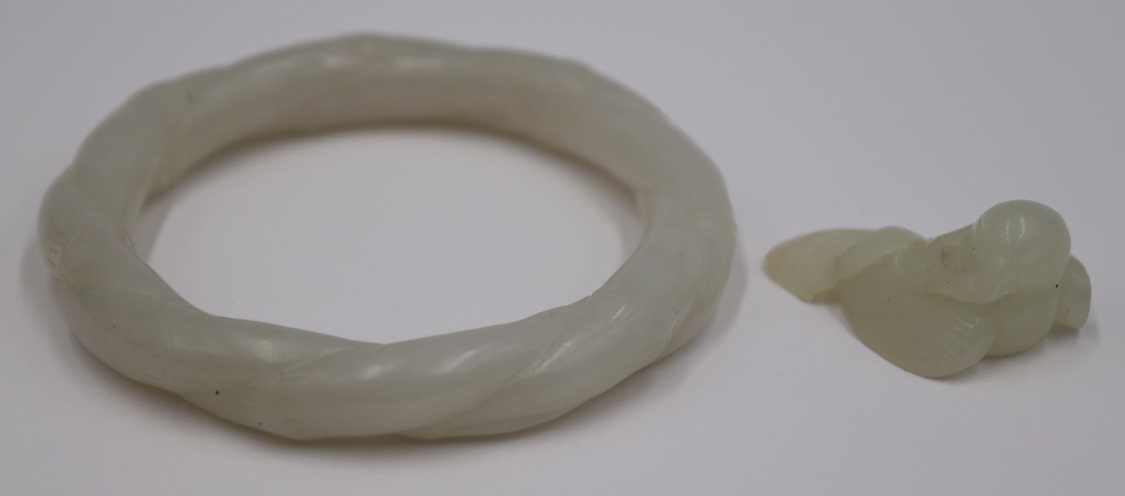 CARVED WHITE JADE GROUPING. Includes
