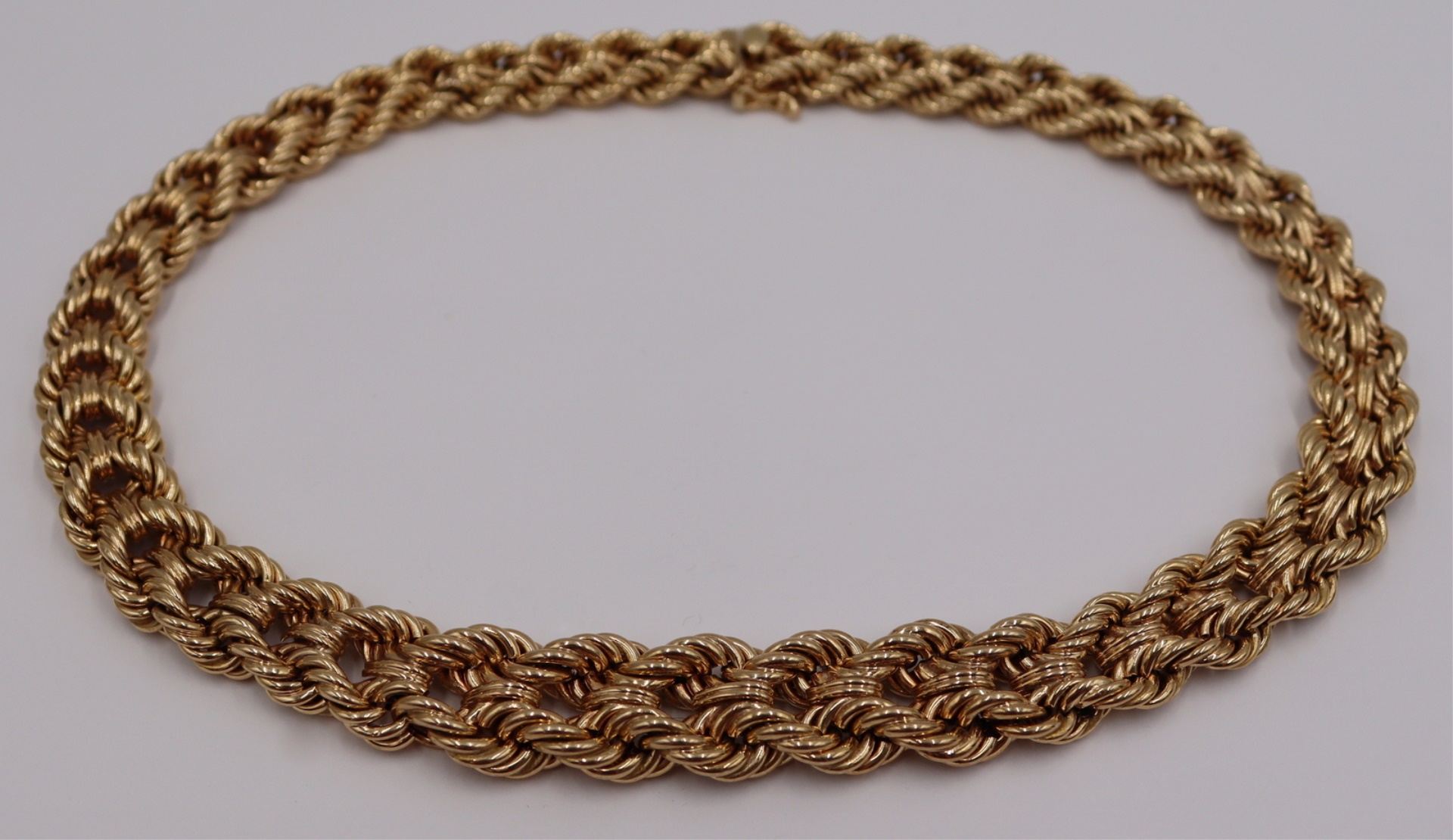 JEWELRY. 14KT GOLD GRADUATED WOVEN