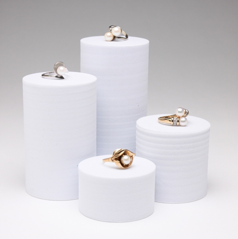 FOUR PEARL AND GOLD RINGS. Late