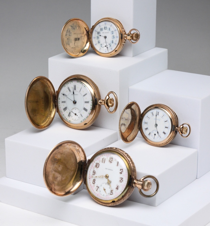 FOUR FANCY DIAL COLUMBUS POCKET WATCHES.