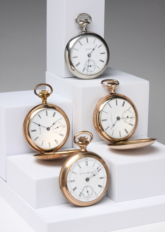 FOUR COLUMBUS TRANSITION POCKET WATCHES.