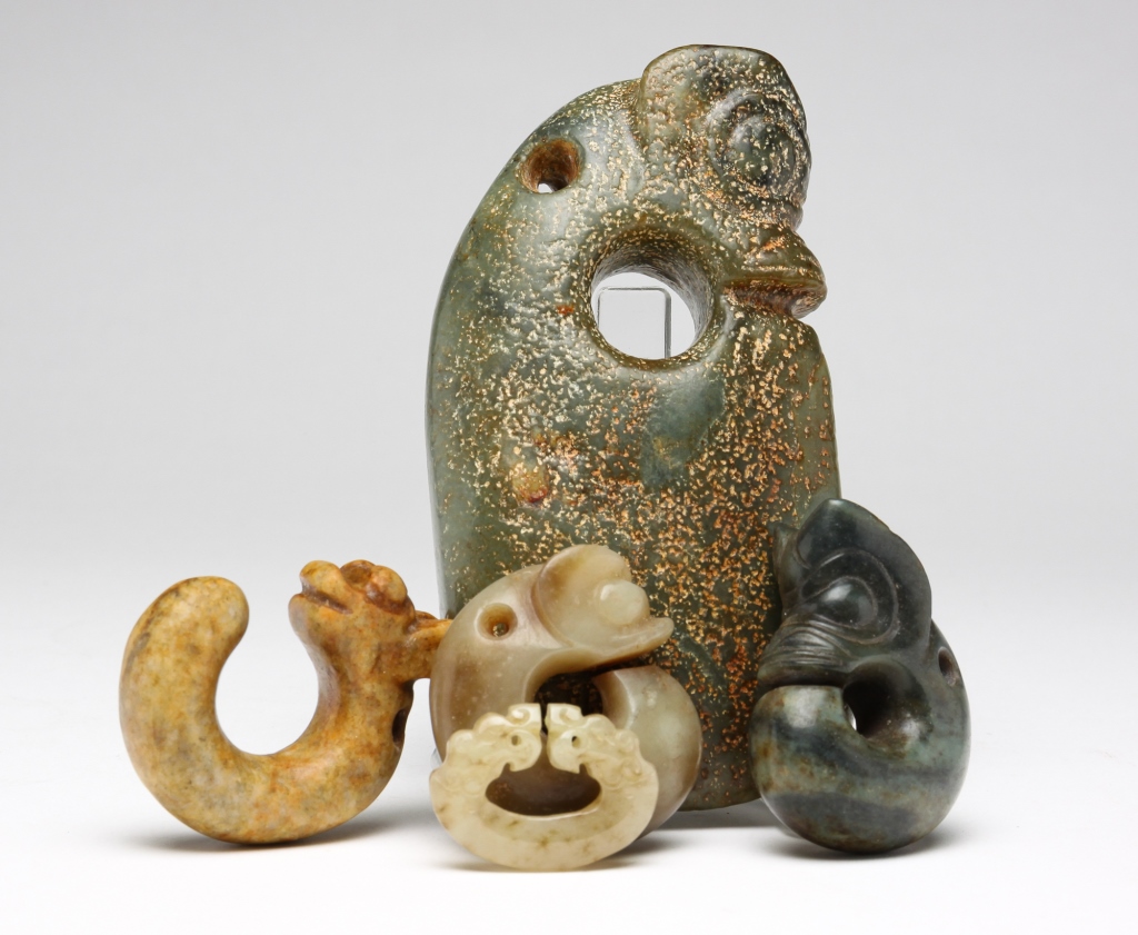 FOUR CHINESE PIG DRAGON STONE CARVINGS.