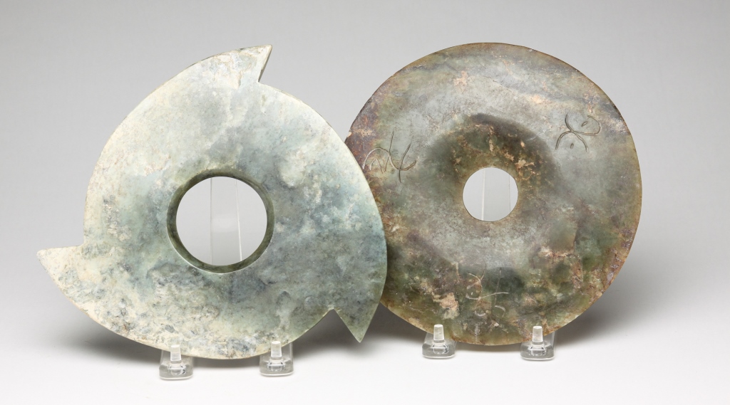 TWO CHINESE CARVED STONE BI DISKS.