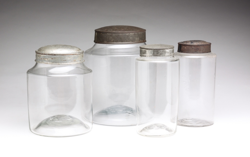 FOUR AMERICAN BLOWN GLASS CANISTERS.