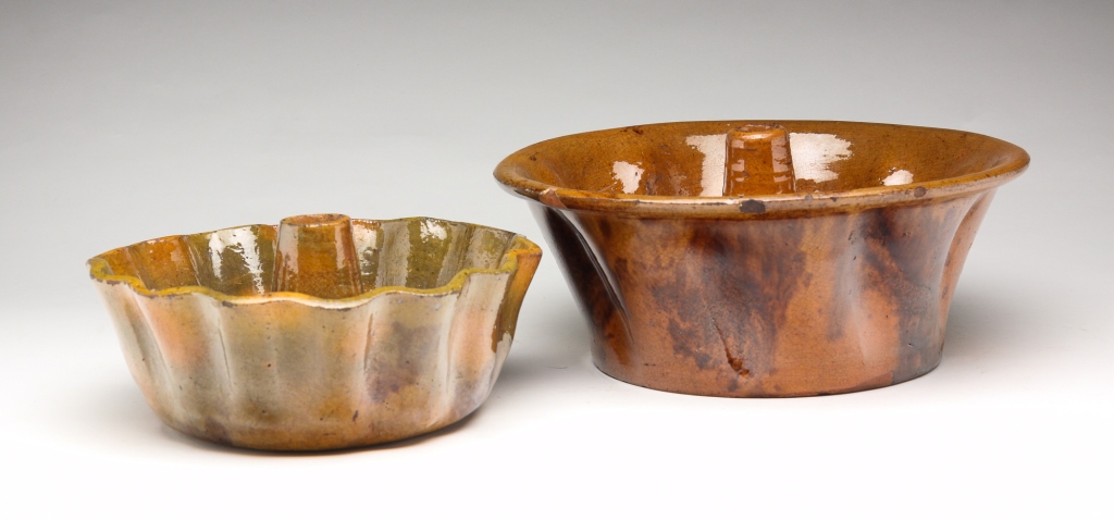 TWO AMERICAN REDWARE FOOD MOLDS.