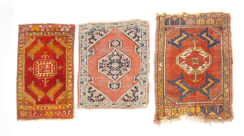 THREE ORIENTAL MATS. Mid 20th century.