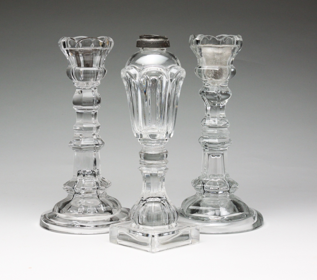 TWO PRESSED GLASS CANDLESTICKS