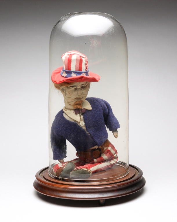 UNCLE SAM DOLL IN GLASS CLOCHE.