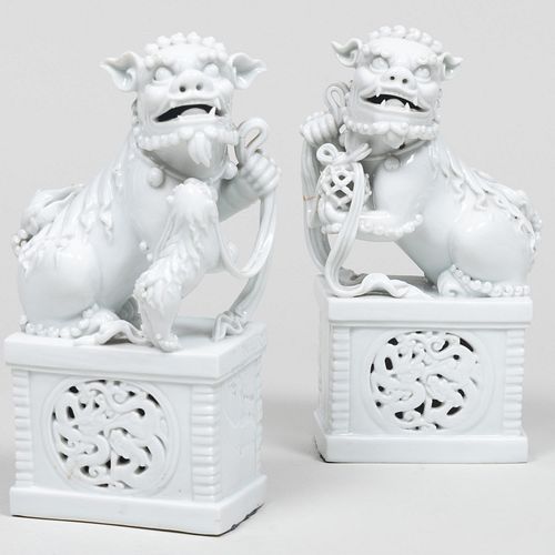 PAIR OF CHINESE WHITE GLAZED BUDDHIST