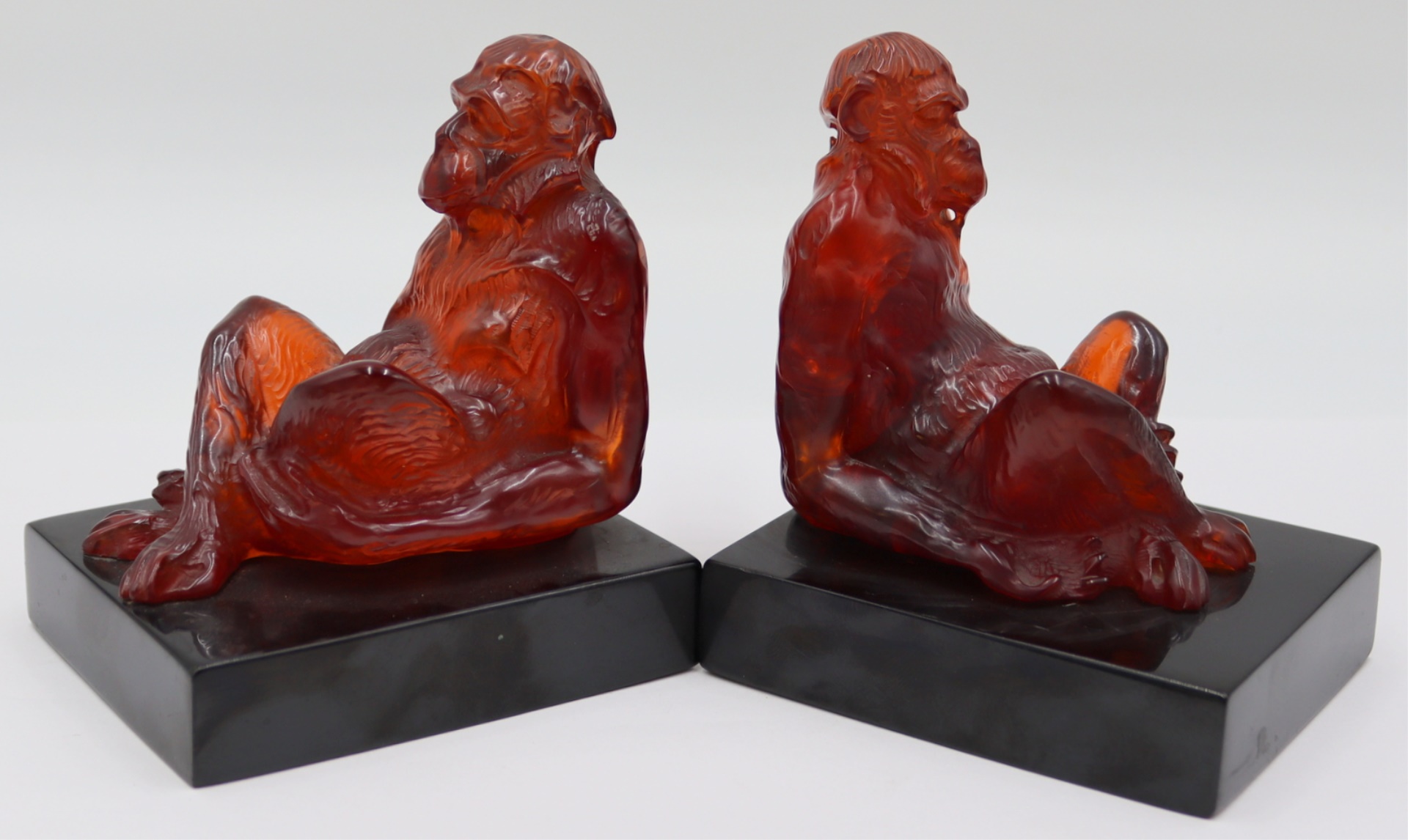 PAIR OF CARVED POSSIBLY AMBER MONKEY