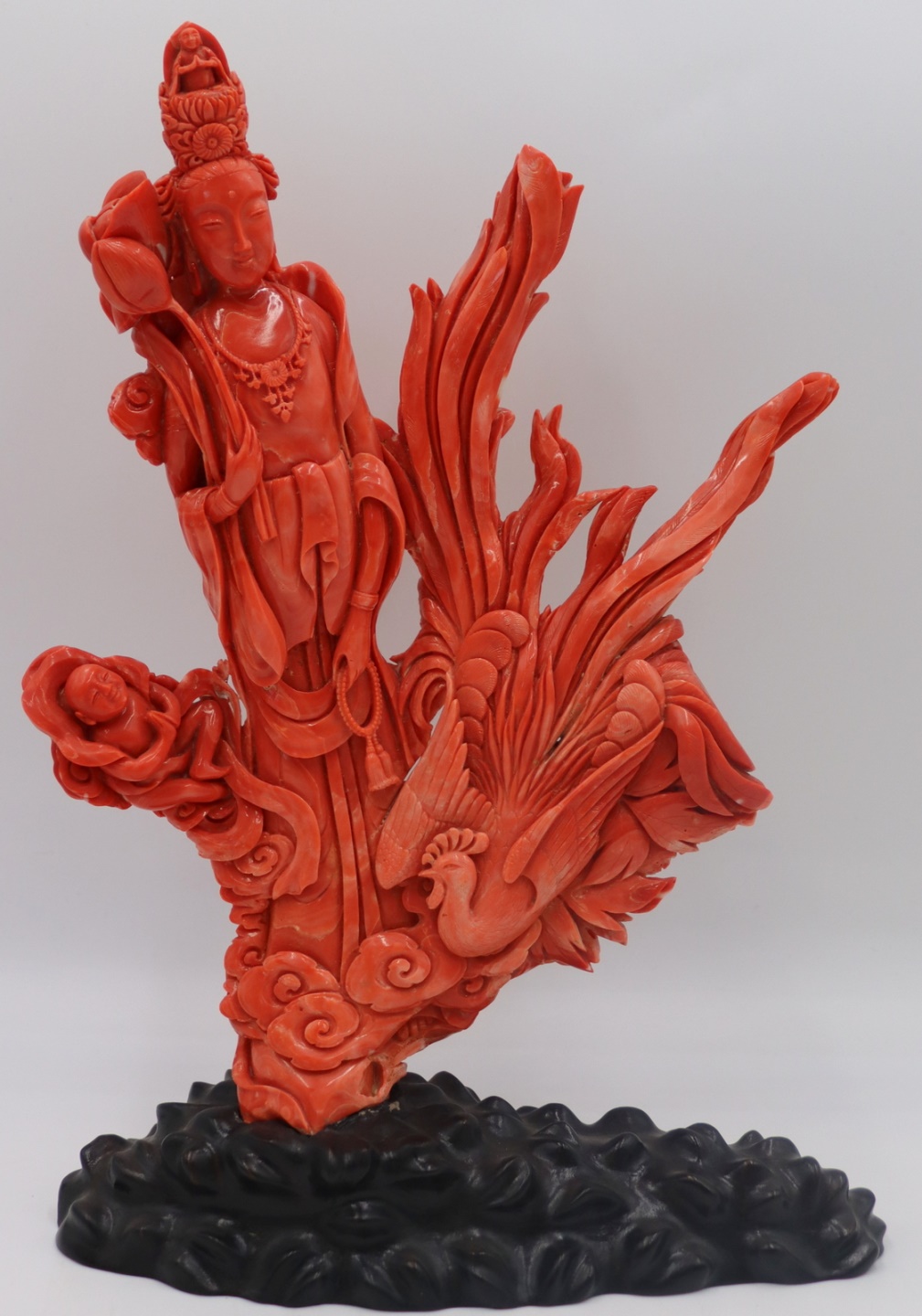 LARGE CARVED CORAL FIGURAL GROUPING.