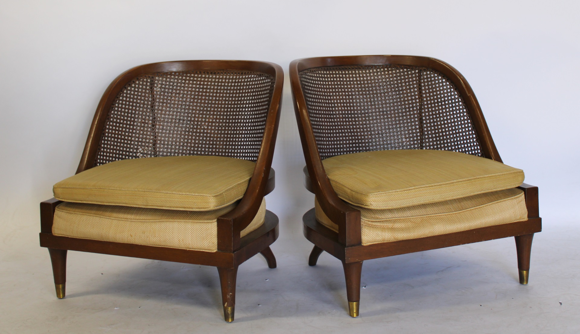 A MIDCENTURY PAIR OF CURVED & CANED