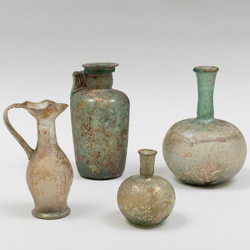 GROUP OF FOUR ROMAN GLASS VESSELSThe