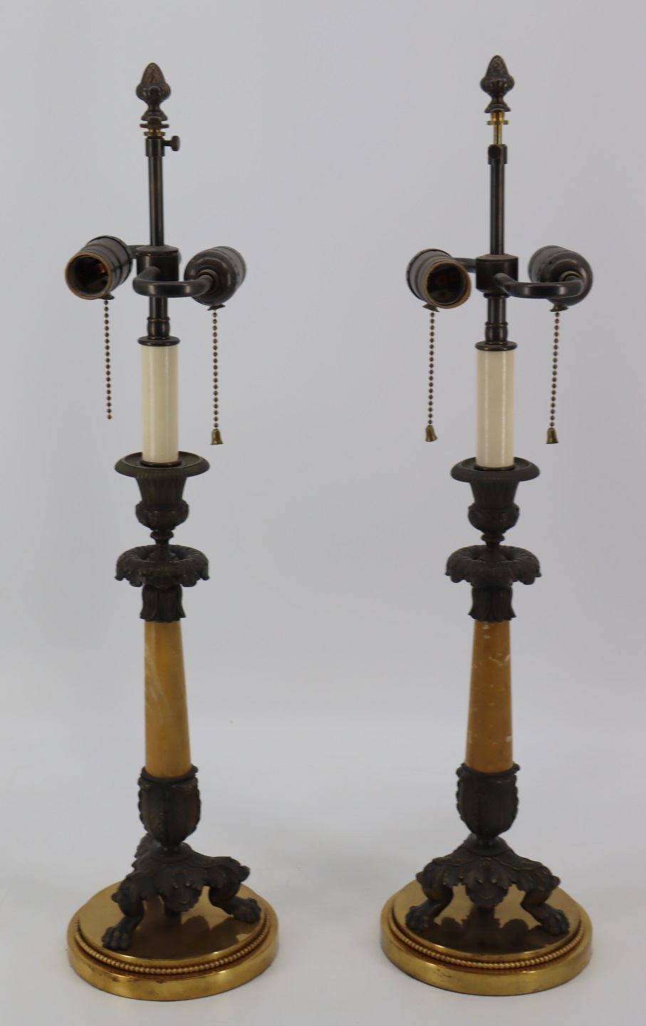 A PAIR OF BRONZE & MARBLE CANDLE STICKS