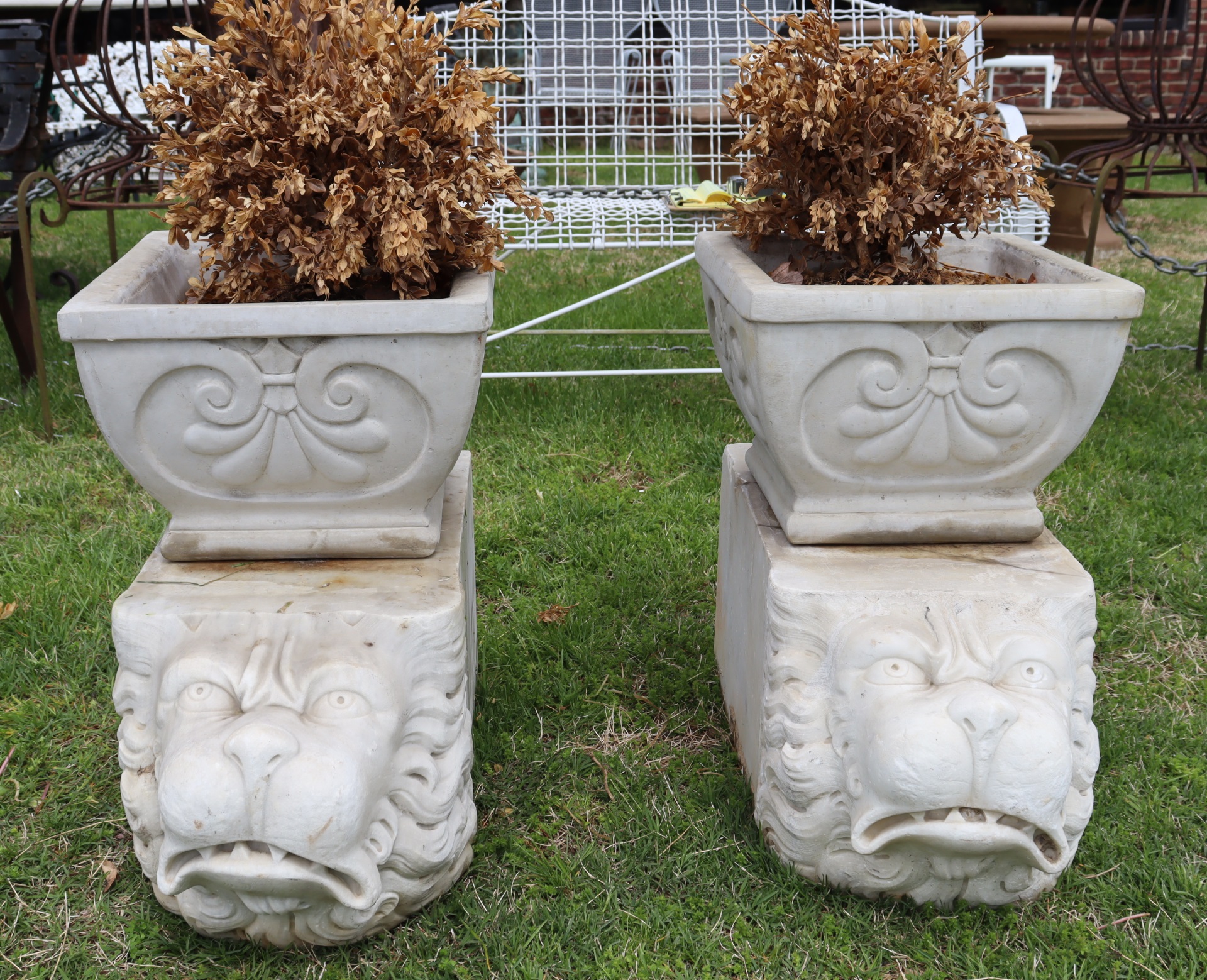 A VINTAGE OF STONE PLANTERS ON