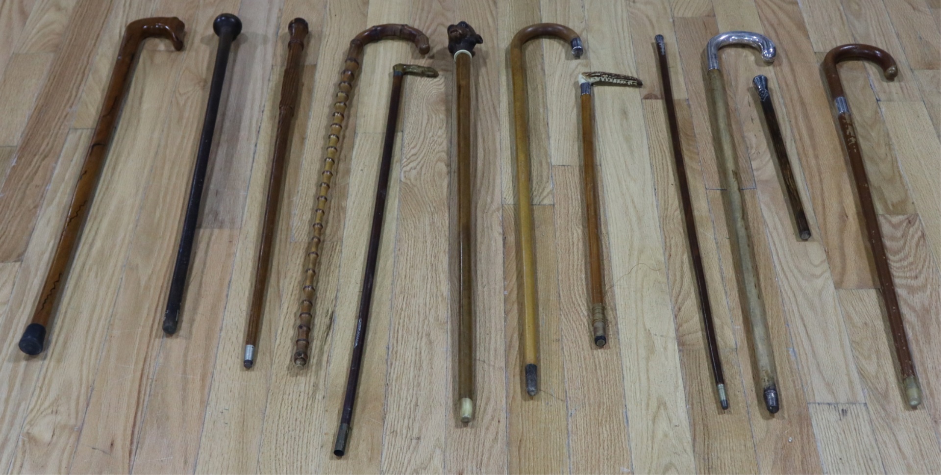 SILVER. LOT OF (12) VINTAGE CANES