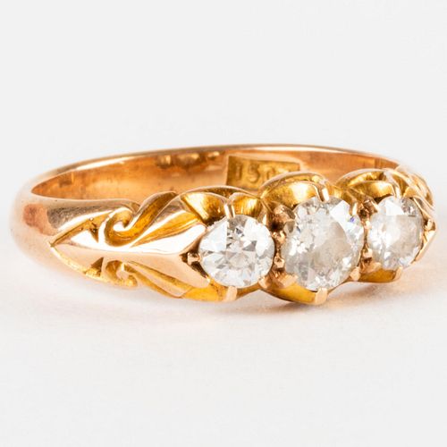 GOLD AND DIAMOND RINGMarked '15CT'.

Size