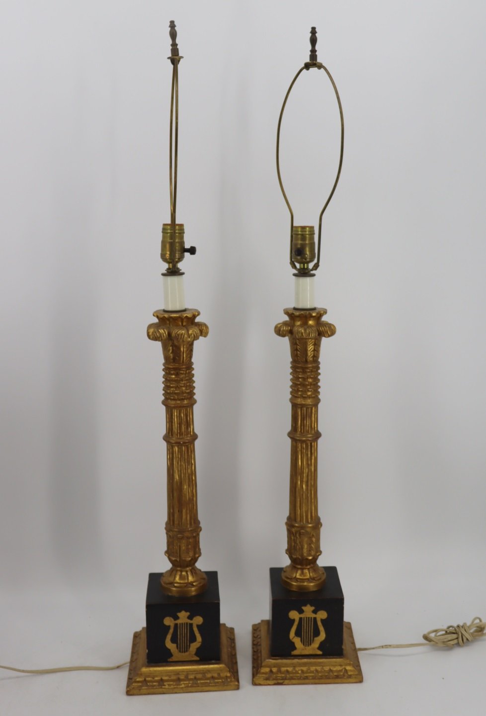 A PAIR OF CARVED GILT AND PAINT