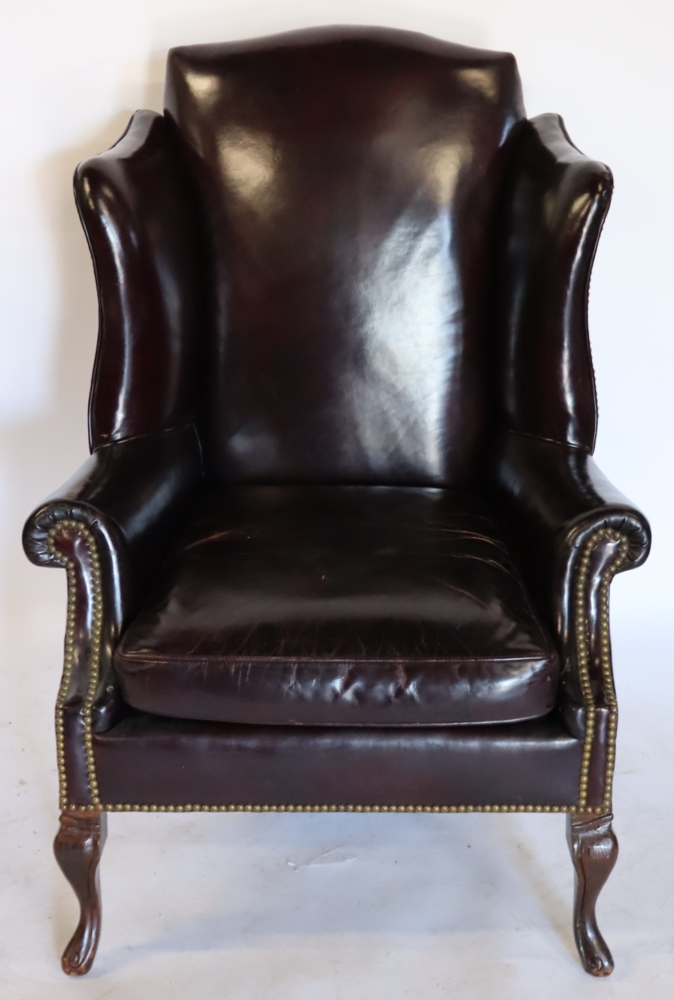 ANTIQUE LEATHER WING CHAIR & A