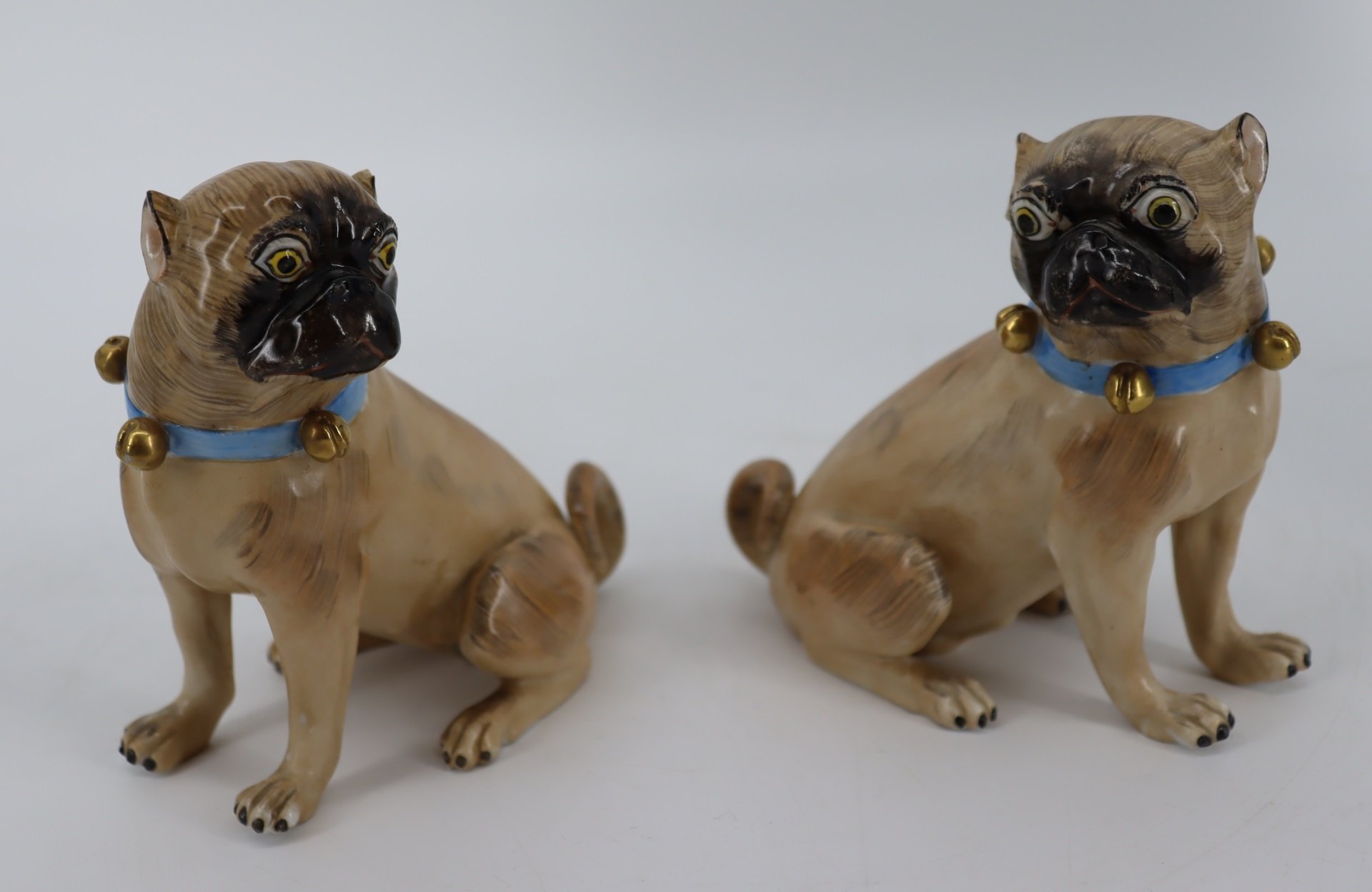 A PAIR OF DRESDEN PORCELAIN PUG