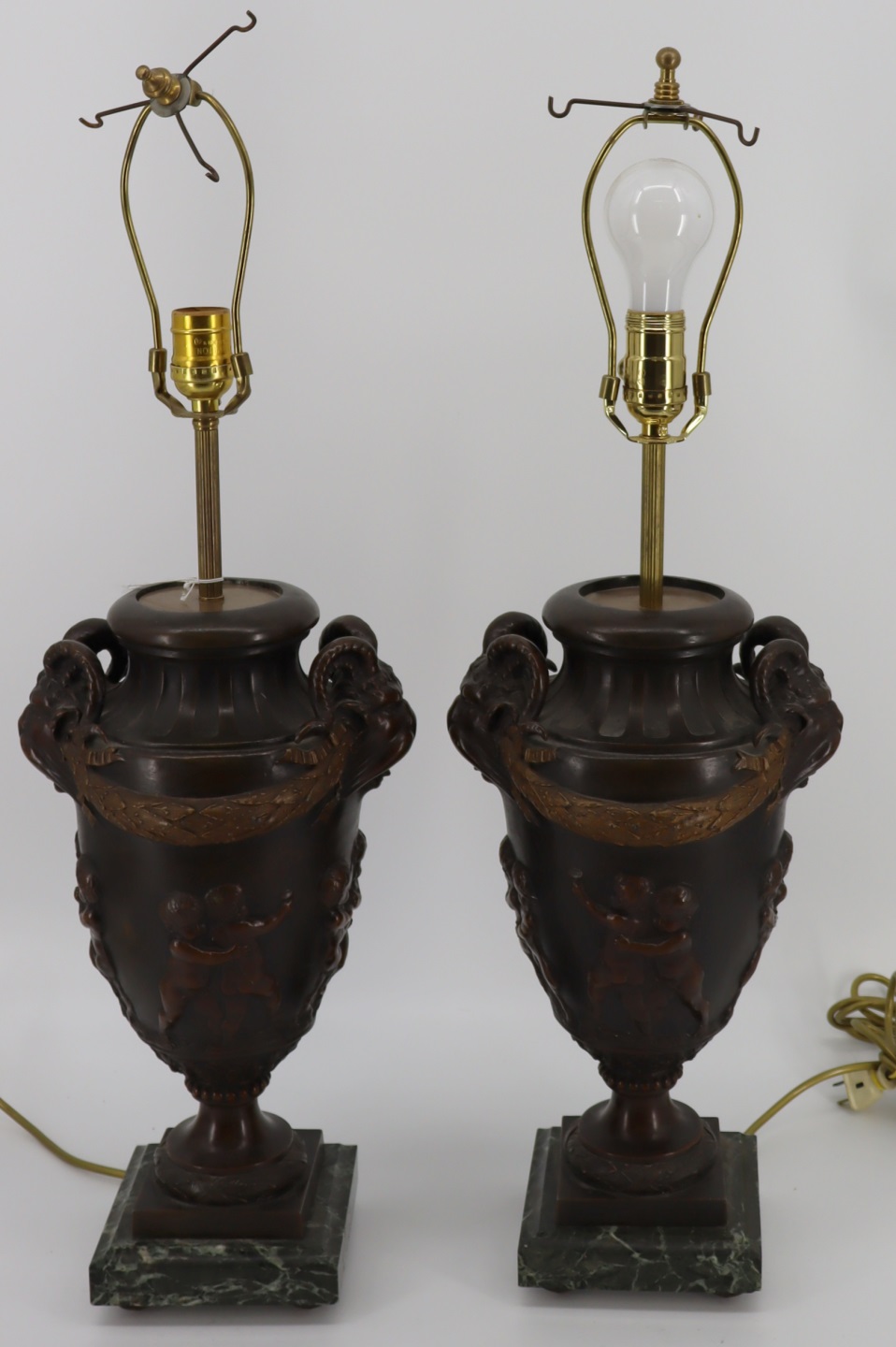 AN ANTIQUE PAIR OF PATINATED METAL