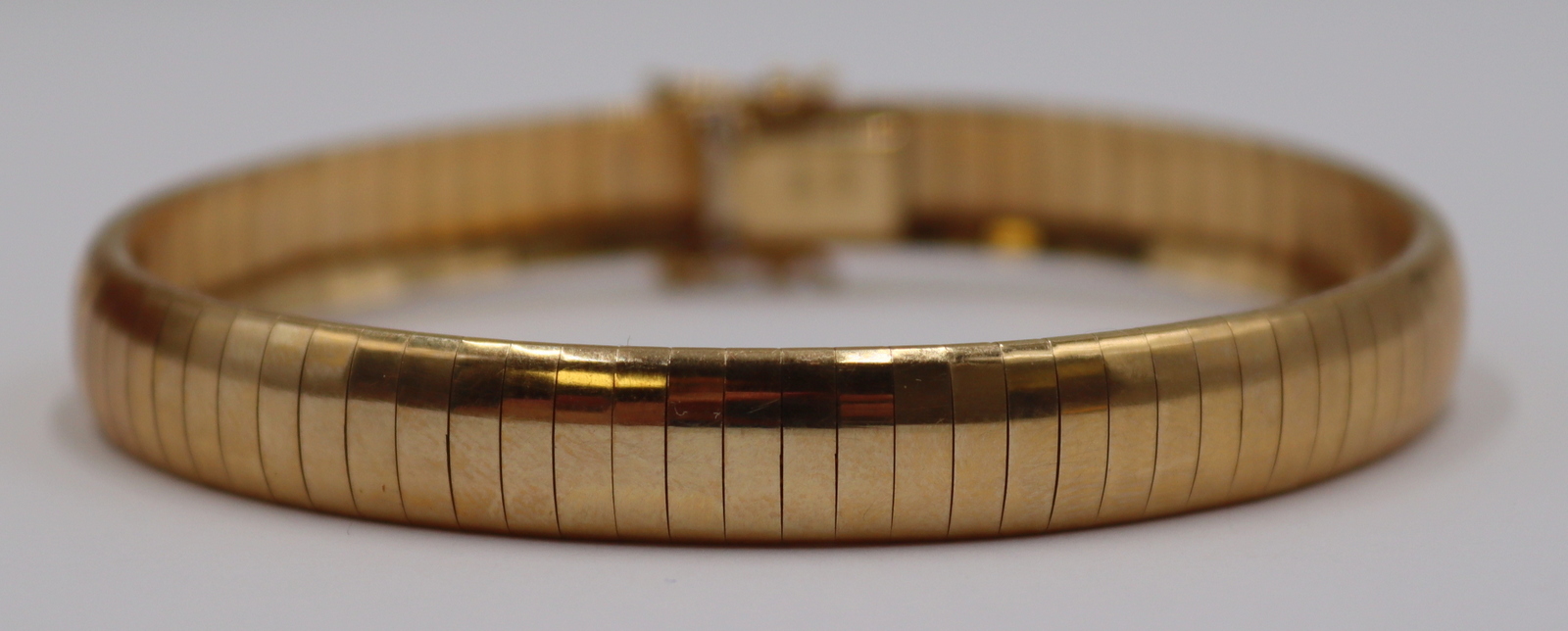 JEWELRY. ITALIAN 14KT GOLD OMEGA