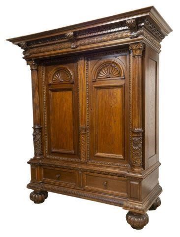 CONTINENTAL WELL-CARVED OAK CABINET,