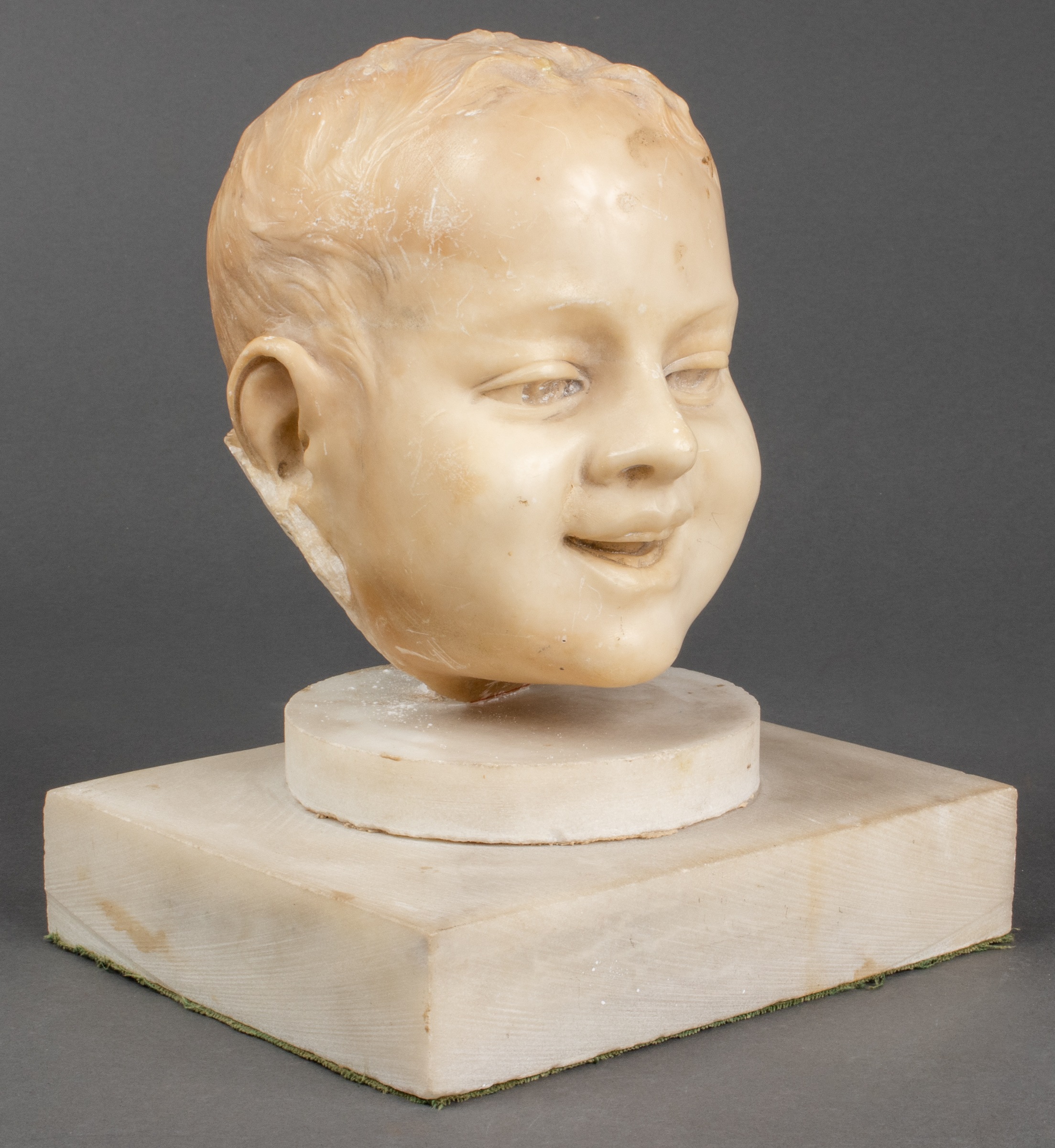 CARVED MARBLE FRAGMENT OF A YOUNG