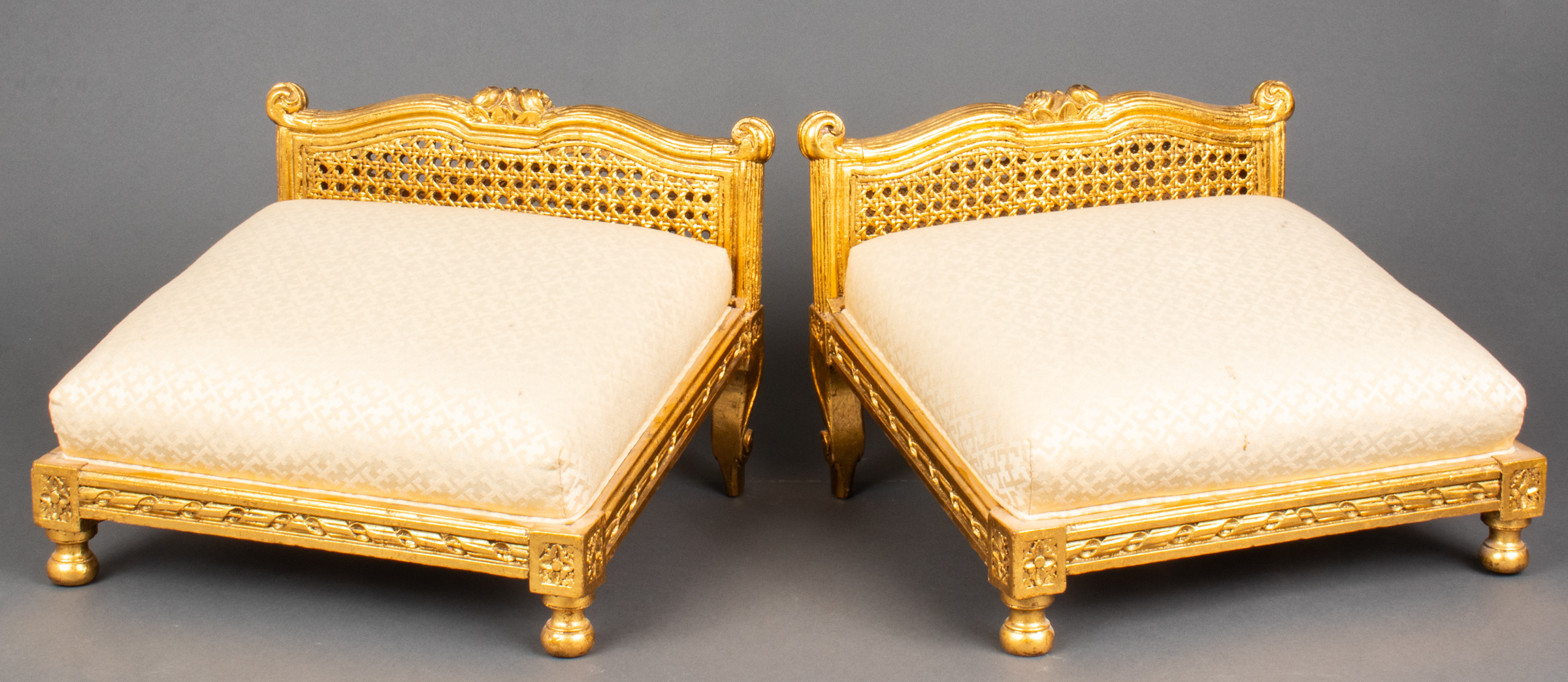 LOUIS XV STYLE CANED GILTWOOD TABOURETS,