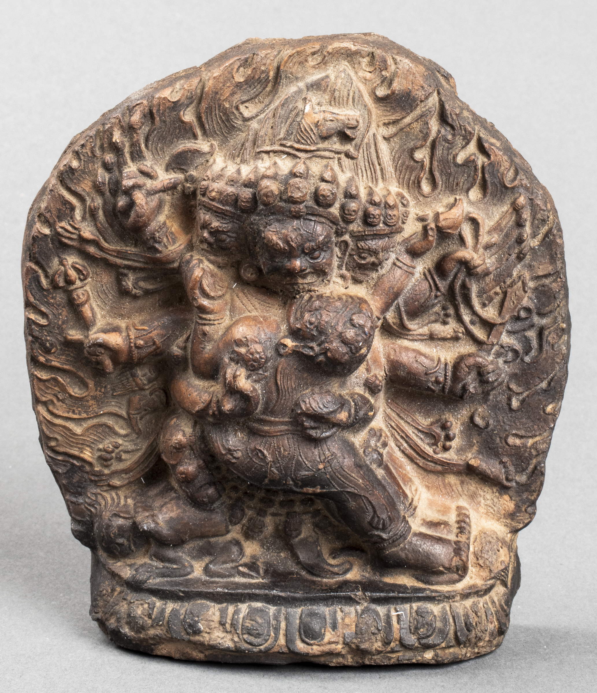 TIBETAN CARVED POTTERY FIGURE OF