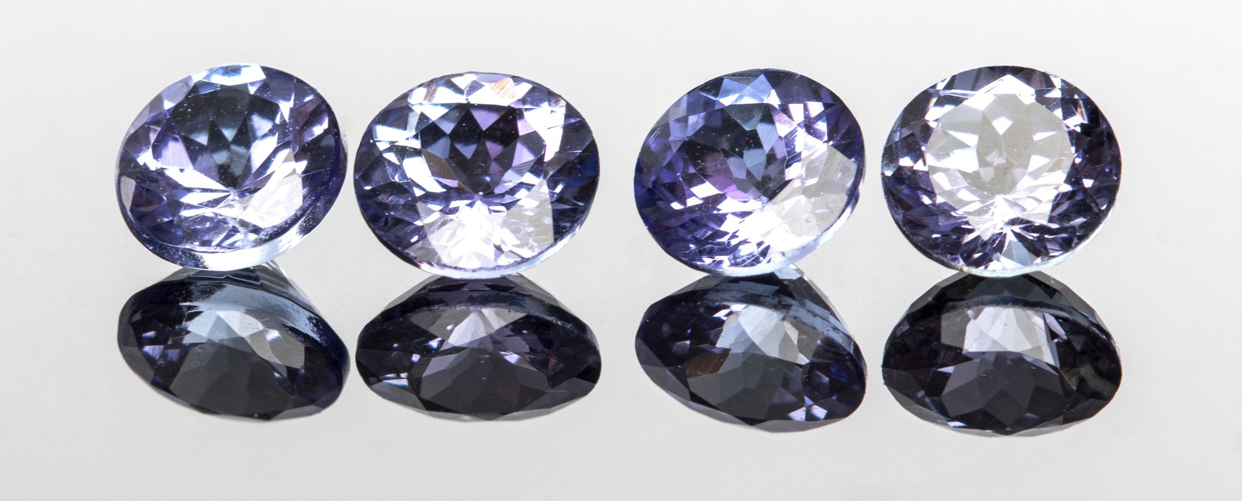 TWO PAIRS OF LOOSE ROUND-CUT TANZANITE