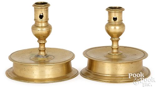 TWO SIMILAR BRASS CAPSTAN CANDLESTICKSTwo 3c5cd5