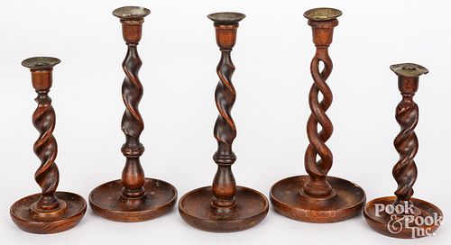 FIVE ENGLISH OAK SPIRAL CANDLESTICKSFive