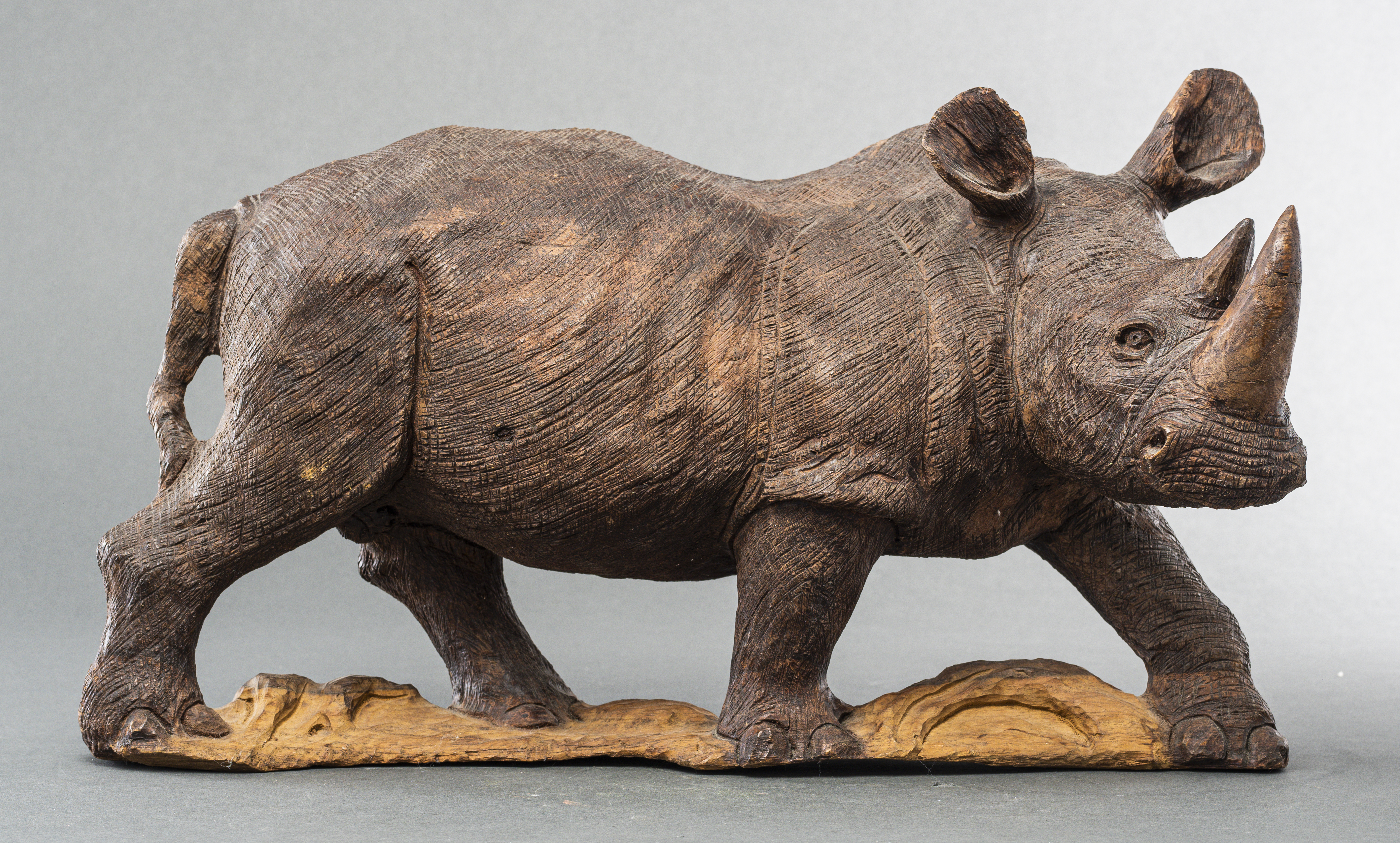 CARVED WOOD SCULPTURE OF A RHINOCEROS 3c50f8