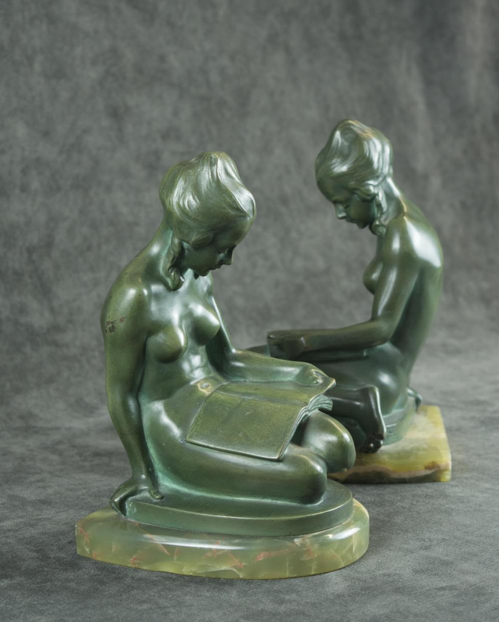 A PAIR OF FIGURAL BRONZE BOOKENDSA PAIR