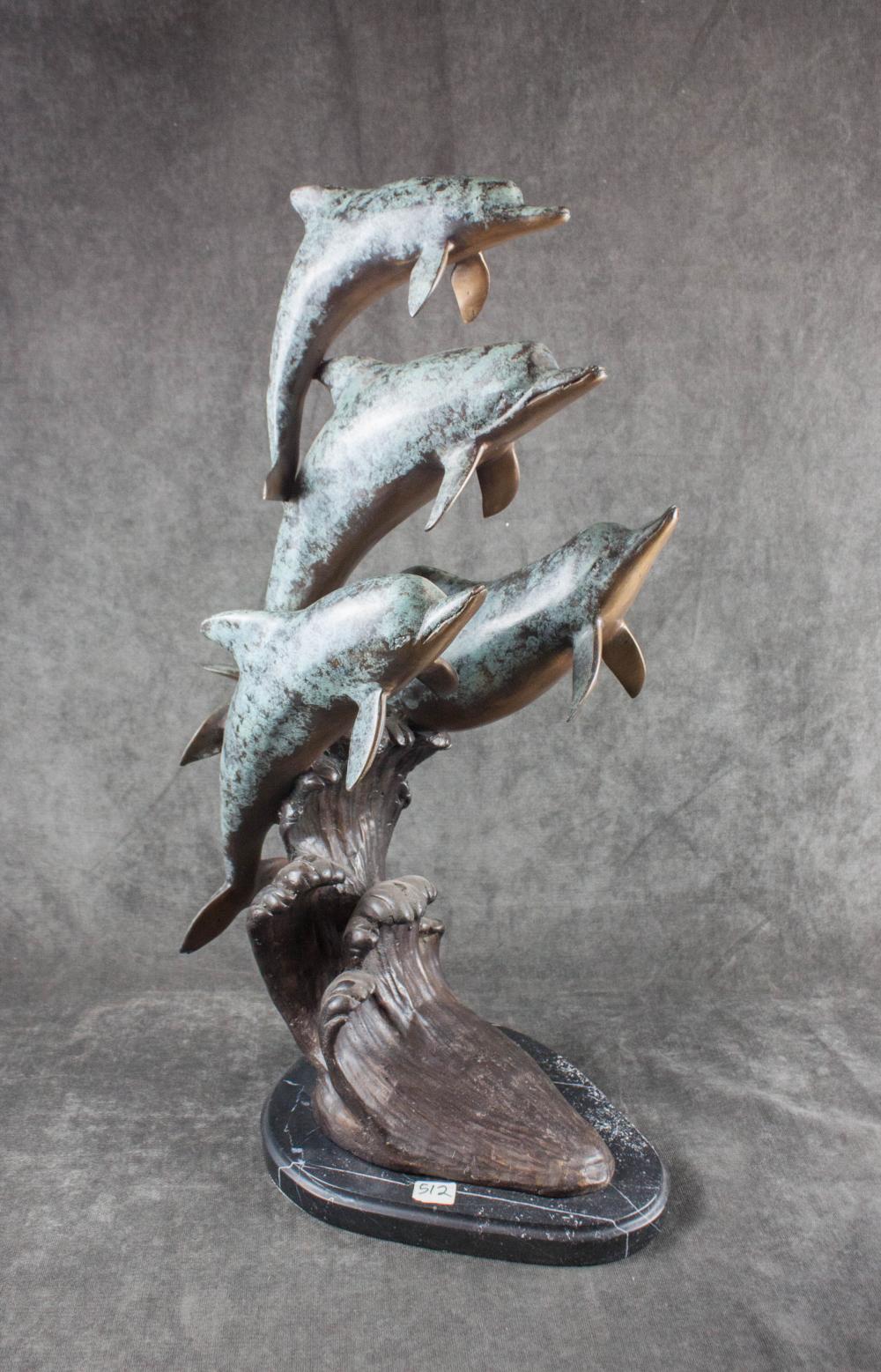 BRONZE SCULPTURE WITH FOUR DOLPHINSBRONZE