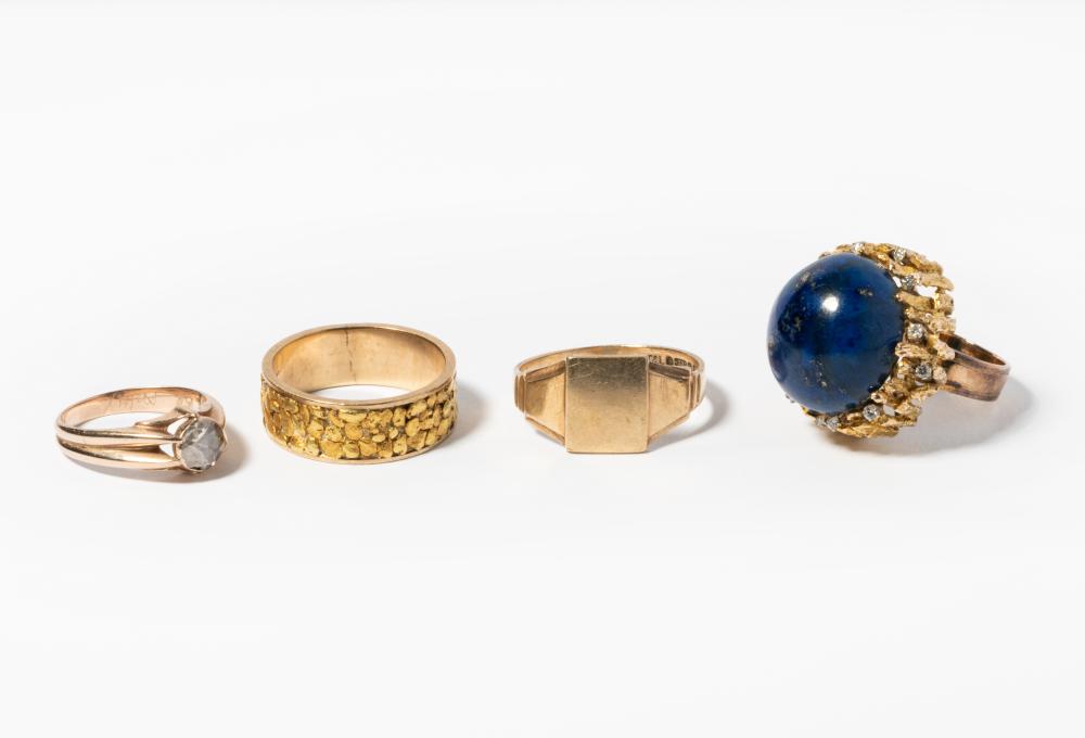 GROUP OF FOUR YELLOW GOLD RINGSGroup