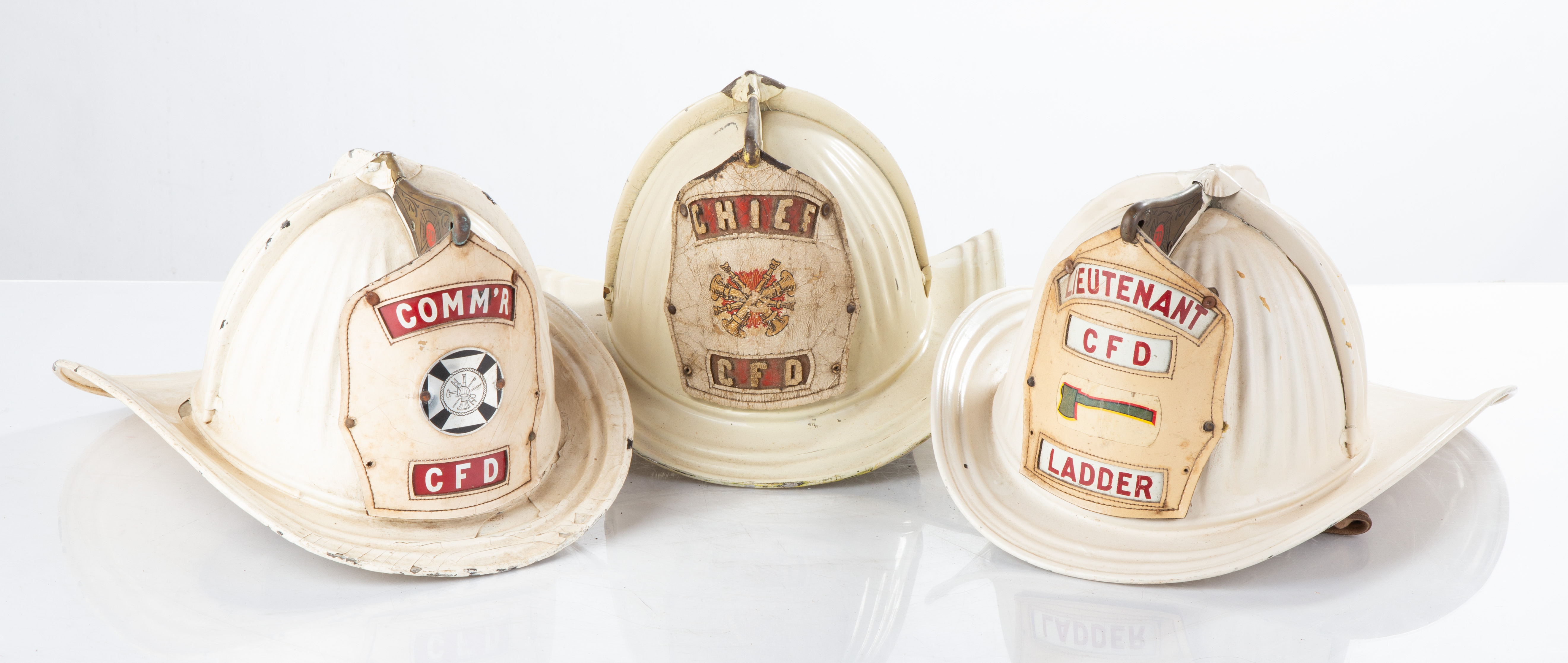 (3) METAL FIREMANS HELMETS Circa 1900.