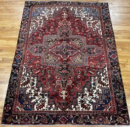 A semi-antique room size Heriz rug,