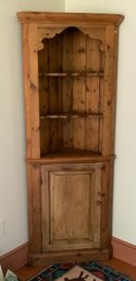 A 20th C. pine corner cupboard,
