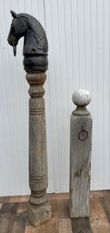 A wood hitching post with iron